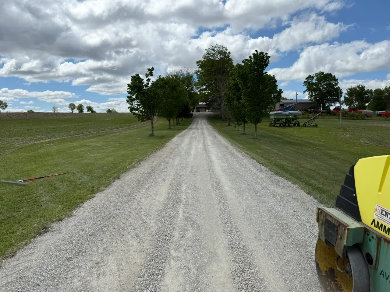 Finished gravel driveway restoration showing compacted aggregate